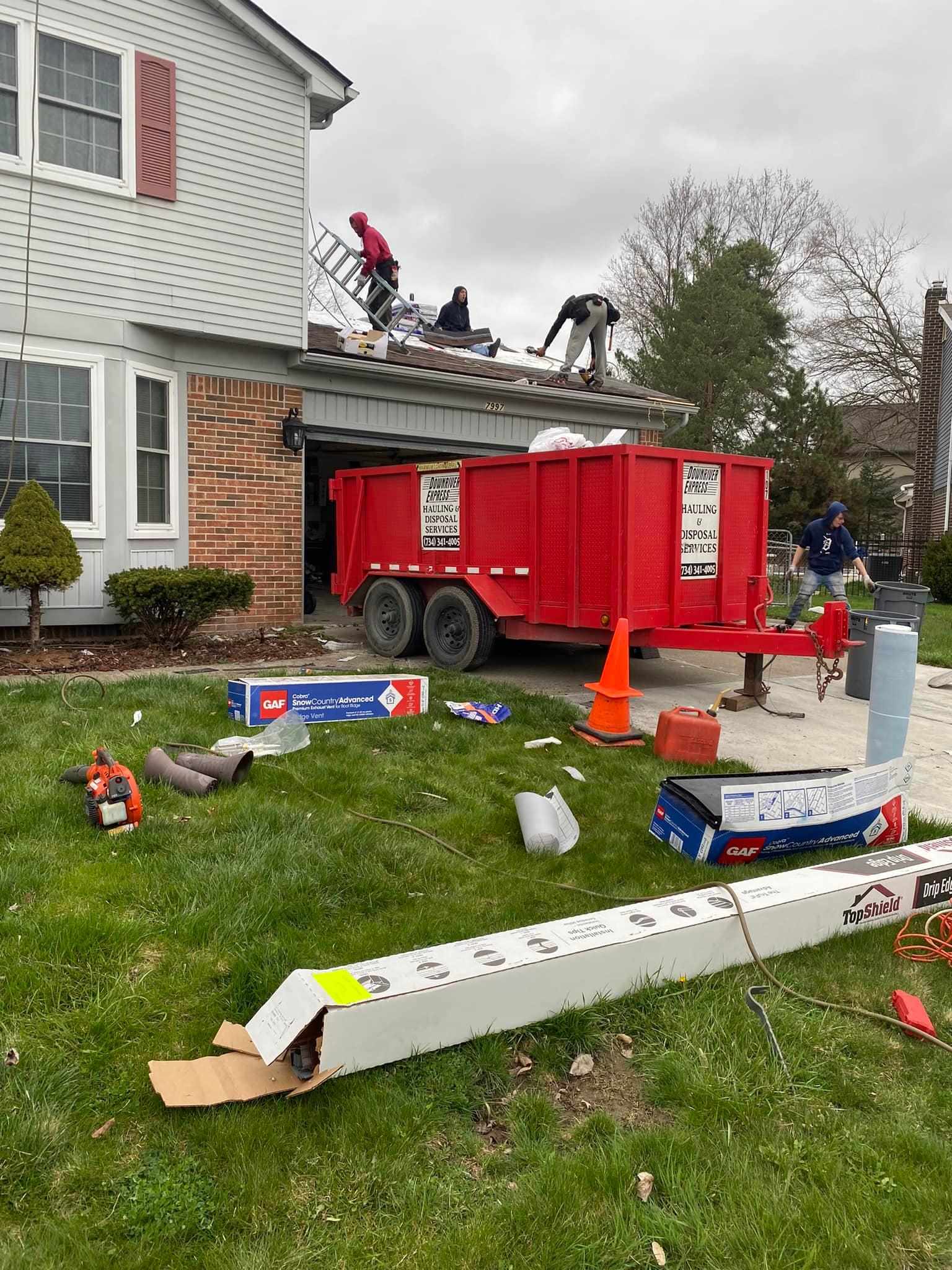 10-yard dumpster on driveway